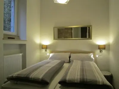Ein Bett oder Betten in einem Zimmer der Unterkunft Ferienwohnung Eichelgasse Wertheim