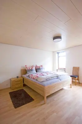 Ein Bett oder Betten in einem Zimmer der Unterkunft Ferienwohnungen Anneliese