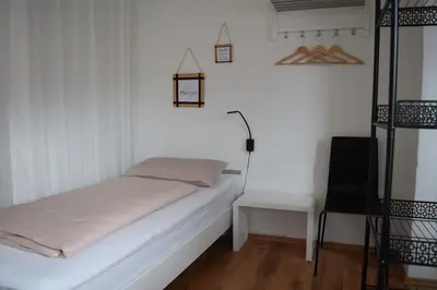 Ein Bett oder Betten in einem Zimmer der Unterkunft Ferienwohnung auf dem Dorf, Külsheim