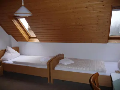 Ein Bett oder Betten in einem Zimmer der Unterkunft Wengerterstube & Gästezimmer Kern