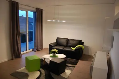 Ein Sitzbereich in der Unterkunft Boardinghouse-Niedernberg