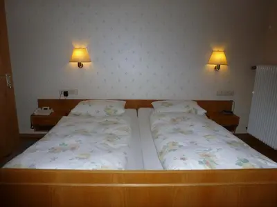 Ein Bett oder Betten in einem Zimmer der Unterkunft Waldschlösschen