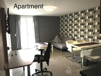 Ein Sitzbereich in der Unterkunft Hotel Mythos 