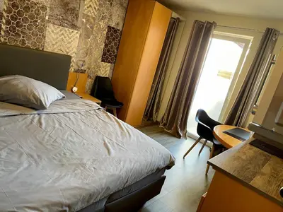 Ein Bett oder Betten in einem Zimmer der Unterkunft Hotel Mythos 