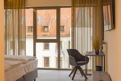 Ein Bett oder Betten in einem Zimmer der Unterkunft Hotel Schloss Lehen