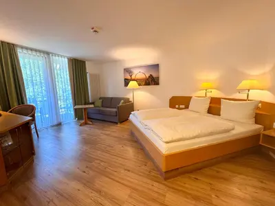 Ein Bett oder Betten in einem Zimmer der Unterkunft Hotel - Restaurant Bastenhaus