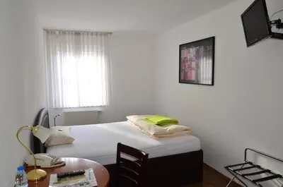 Ein Bett oder Betten in einem Zimmer der Unterkunft Hotel Mörike