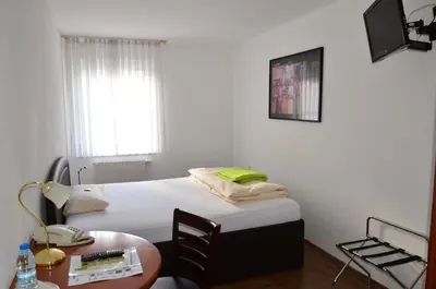 Ein Bett oder Betten in einem Zimmer der Unterkunft Hotel Mörike