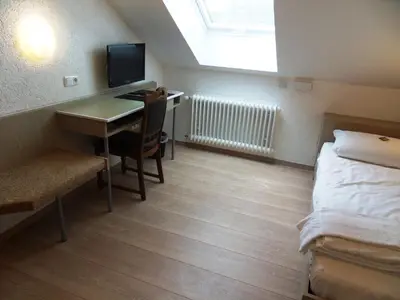 Ein Bett oder Betten in einem Zimmer der Unterkunft Hotel Linnert