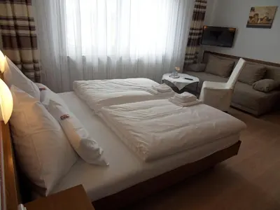 Ein Bett oder Betten in einem Zimmer der Unterkunft Hotel Linnert