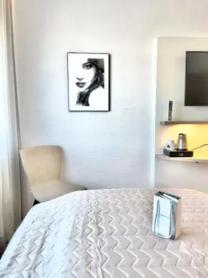 Ein Bett oder Betten in einem Zimmer der Unterkunft ART-Hotel Braun