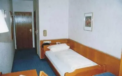 Ein Bett oder Betten in einem Zimmer der Unterkunft Hotel Ludwigstal