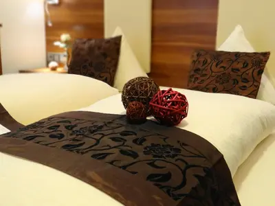 Ein Bett oder Betten in einem Zimmer der Unterkunft Hotel Schützenhof mit Wellness