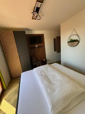 Ein Bett oder Betten in einem Zimmer der Unterkunft Rebstöckel
