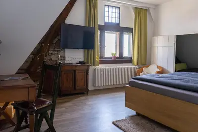 Ein Bett oder Betten in einem Zimmer der Unterkunft Altes Amtsgericht Oppenheim