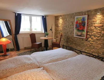 Ein Bett oder Betten in einem Zimmer der Unterkunft Hotel Weingewolbe