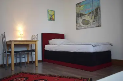 Ein Bett oder Betten in einem Zimmer der Unterkunft Ferienwohnung Gruppenhaus bis 12 Personen