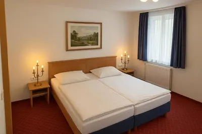 Ein Bett oder Betten in einem Zimmer der Unterkunft Hotel Schillerplatz