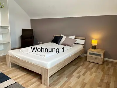 Ein Bett oder Betten in einem Zimmer der Unterkunft Ferienwohung Weinheim