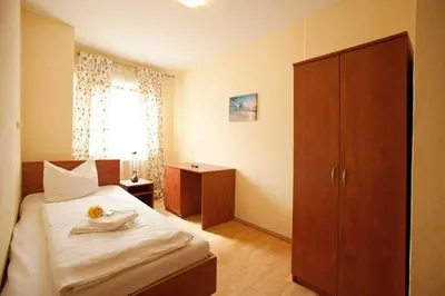 Ein Bett oder Betten in einem Zimmer der Unterkunft Hotel Jasmin
