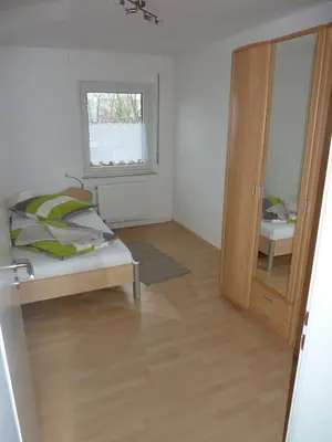 Ein Bett oder Betten in einem Zimmer der Unterkunft Ferienwohnung Landwehr