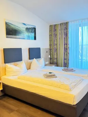 Ein Bett oder Betten in einem Zimmer der Unterkunft Küffner Hof
