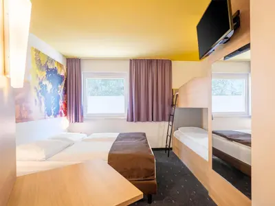 Ein Bett oder Betten in einem Zimmer der Unterkunft B&B Hotel Heilbronn