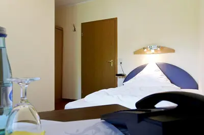 Ein Bett oder Betten in einem Zimmer der Unterkunft Gasthof & Landhotel Ohrnbachtal