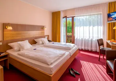 Ein Bett oder Betten in einem Zimmer der Unterkunft Gasthof & Landhotel Ohrnbachtal