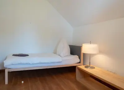Ein Bett oder Betten in einem Zimmer der Unterkunft Gruppenhaus Darmstadt