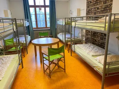 Ein Bett oder Betten in einem Zimmer der Unterkunft Steffis Hostel Heidelberg