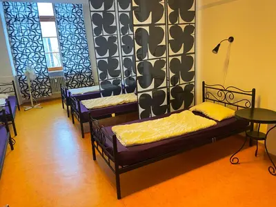 Ein Bett oder Betten in einem Zimmer der Unterkunft Steffis Hostel Heidelberg