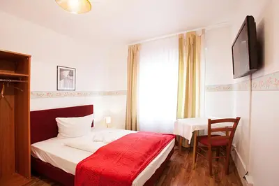 Ein Bett oder Betten in einem Zimmer der Unterkunft Pension Jasmin