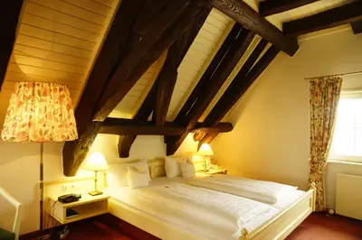 Ein Bett oder Betten in einem Zimmer der Unterkunft Walk'sches Haus