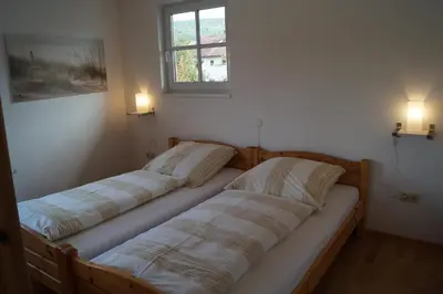 Ein Bett oder Betten in einem Zimmer der Unterkunft Ferienhaus in Wörth am Main