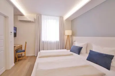 Ein Bett oder Betten in einem Zimmer der Unterkunft Landidyll Hotel Klostermühle