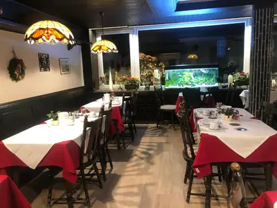 Ein Restaurant oder anderes Speiselokal in der Unterkunft Hotel Regina