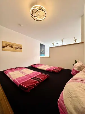 Ein Bett oder Betten in einem Zimmer der Unterkunft Appartment in Freizeitpark