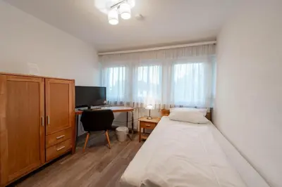 Ein Bett oder Betten in einem Zimmer der Unterkunft Westend Hotel