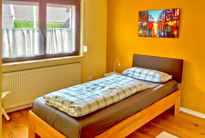Ein Bett oder Betten in einem Zimmer der Unterkunft Ferienwohnung Mäder