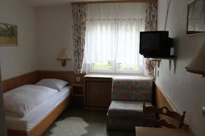 Ein Bett oder Betten in einem Zimmer der Unterkunft Gasthof Jäger