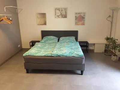 Ein Bett oder Betten in einem Zimmer der Unterkunft Gemütliches Apartment nahe Porsche