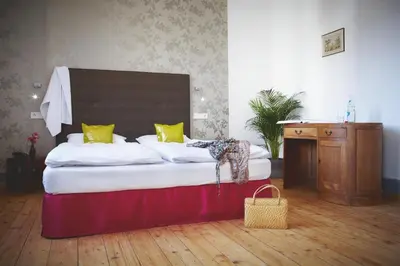 Ein Bett oder Betten in einem Zimmer der Unterkunft Hotel Tannhäuser