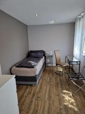 Ein Bett oder Betten in einem Zimmer der Unterkunft Ferienwohnung Alte Linde