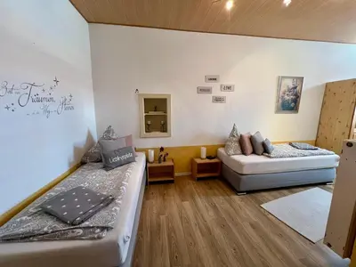 Ein Bett oder Betten in einem Zimmer der Unterkunft Ferienwohnung Vino Palatina