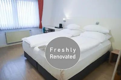 Ein Bett oder Betten in einem Zimmer der Unterkunft AP Hotel Mannheim Viernheim am Kapellenberg