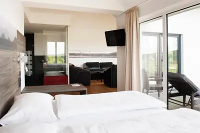 Ein Bett oder Betten in einem Zimmer der Unterkunft BURGHOF - DAS HOTEL