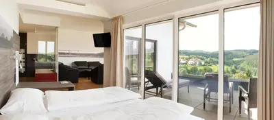 Ein Bett oder Betten in einem Zimmer der Unterkunft BURGHOF - DAS HOTEL