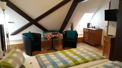 Ein Bett oder Betten in einem Zimmer der Unterkunft Wein-und Gasthof Zipf