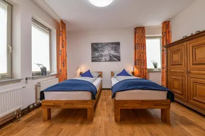 Ein Bett oder Betten in einem Zimmer der Unterkunft Ernst-Ludwig-Promenade